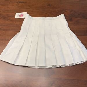 Fashion tennis skirt with built1in shorts. Unworn, with tags.